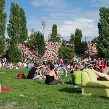Crowd of people on a Sunday in Mauerpark (Wall Park).
