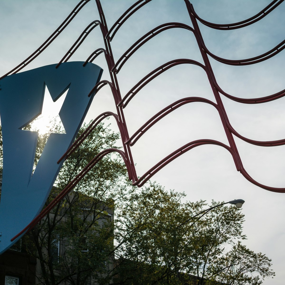 500px Photo ID: 89361423 - The Puertorican flag is the center of attraction at Paseo Boricua on Division Street in Chicago, Il. The section known as Humboldt Park has a large concentration of Puertorican families living in it.