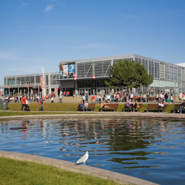 Man-made pond and the Centre des Sciences de Montreal ,Montreal Science Centre, in the Old Port of Montreal in autumn, Quebec, Canada