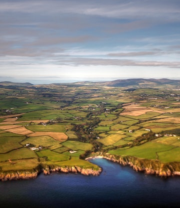 Aerial view of Isle of Man coastline and fields