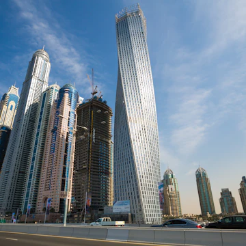 DUBAI - NOVEMBER 16: Dubai Marina skyline. Dubai Marina cityscape. Dubai Marina skyscrapers, Cayan Tower, Princess Tower on November 16, 2014 in Dubai; Shutterstock ID 321128009; Your name (First / Last): Lauren Keith; GL account no.: 65050; Netsuite department name: Online Editorial; Full Product or Project name including edition: Authentic Dubai Article