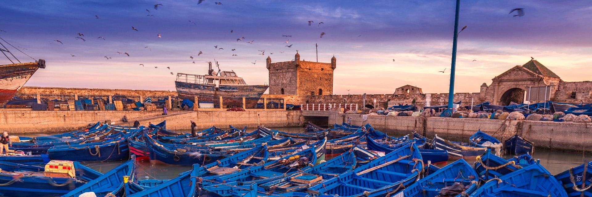Essaouira port in Morocco. Shot  after sunset at blue hour.; Shutterstock ID 469077956; Your name (First / Last): Lauren Keith; GL account no.: 65050; Netsuite department name: Online Editorial; Full Product or Project name including edition: Essaouira BiT