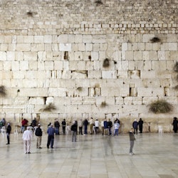 People prays and walk in front of the western wall, wailing wall or kotel.