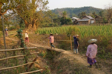 HSIPAW, MYANMAR - FEB 19, 2015 - .Local village women return home in the evening after working in their fields,  Hsipaw,  Myanmar (Burma); Shutterstock ID 292814126; Your name (First / Last): Laura Crawford; GL account no.: 65050; Netsuite department name: Online Editorial; Full Product or Project name including edition: Myanmar website highlights images BiT