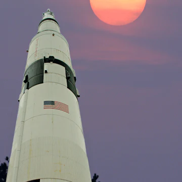 A Saturn 5 rocket appears to be aimming for the moon. The background was taken 10/22/04 at 5:30 pm CST. Taken with a Canon 10D, w/400mm lens set to 400mm. Tv 1/500, Av 8, ISO 400. White balance set to Flurescent. The shot was taken from my front porch in Harvest Al. The Sature 5 was taken 2/17/14 at 2:30 PM CST. at the Space and Rocket center in Huntsville Al. This shot was taken with a canon 7D, with a 28-135 lens set at 28mm. Tv 1/125, Av 6.3, exposure compensation plus 1 and ISO 100. Post process was on the background with PS elements 5, and the rocket with PS element 11 and Perfect photo suite 8.