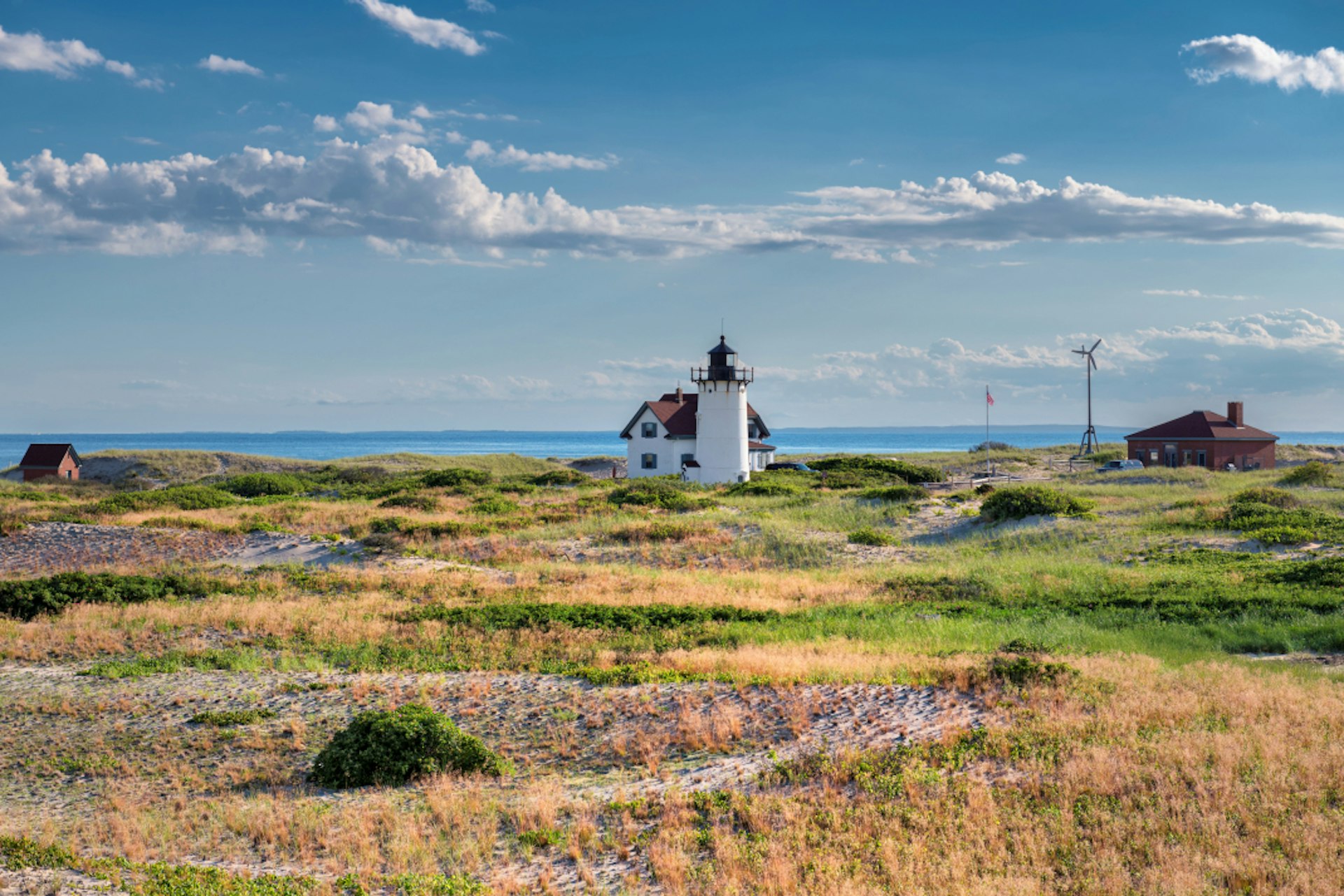 Race Point Light Lighthouse in sand dunes on the beach at Cape Cod, New England,  Massachusetts, USA. 