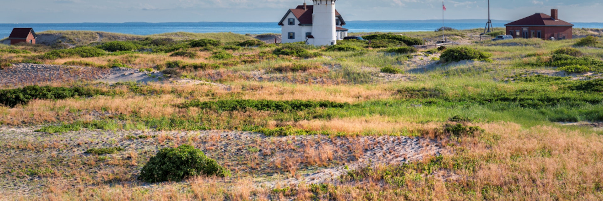 Race Point Light Lighthouse in sand dunes on the beach at Cape Cod, New England,  Massachusetts, USA.