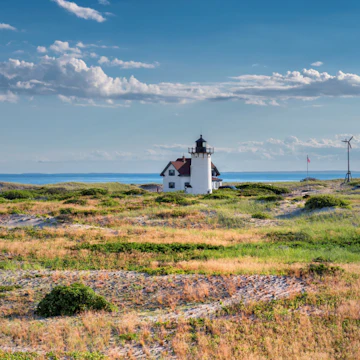Race Point Light Lighthouse in sand dunes on the beach at Cape Cod, New England, Massachusetts, USA.