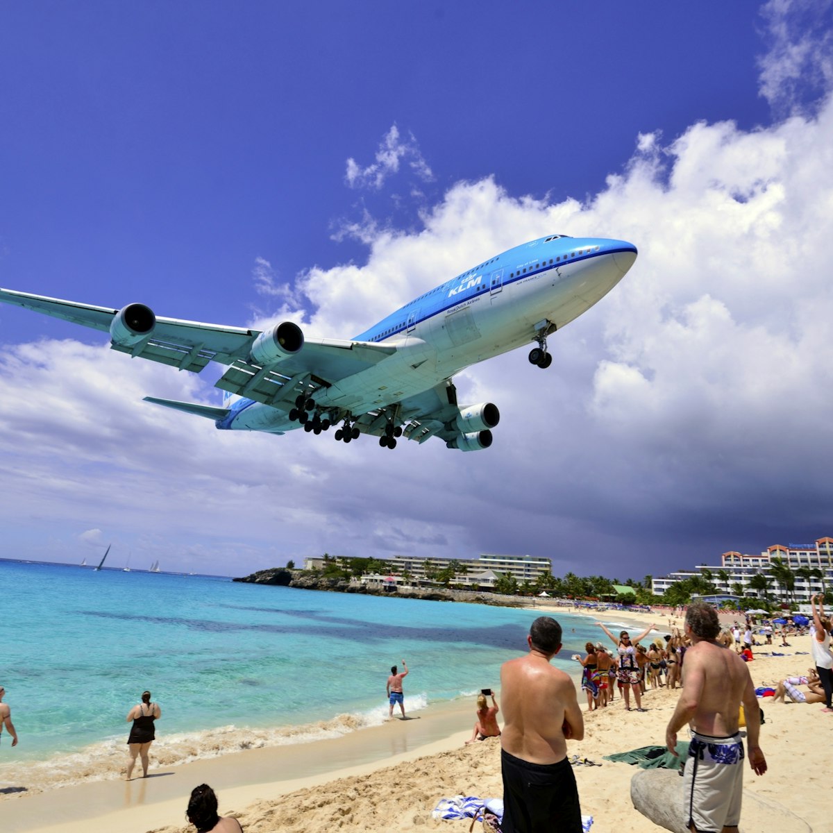 This is #1 in the series of 5 images of the granddaddy of the planes that land at the world famous Princess Juliana International Airport, the 747 KLM flight from Amsterdam.  The landing aircraft glide just feet above beach goers who come here to watch the planes land and takeoff from the airport.