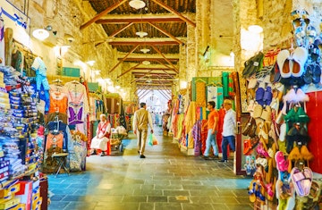 DOHA, QATAR - FEBRUARY 13, 2018: Visit traditional Eastern Souq Waqif with narrow alleyways, full of different goods and noisy vendors, on February 13 in Doha; Shutterstock ID 1166541733; Your name (First / Last): Lauren Keith; GL account no.: 65050; Netsuite department name: Online Editorial; Full Product or Project name including edition: Destination page image update