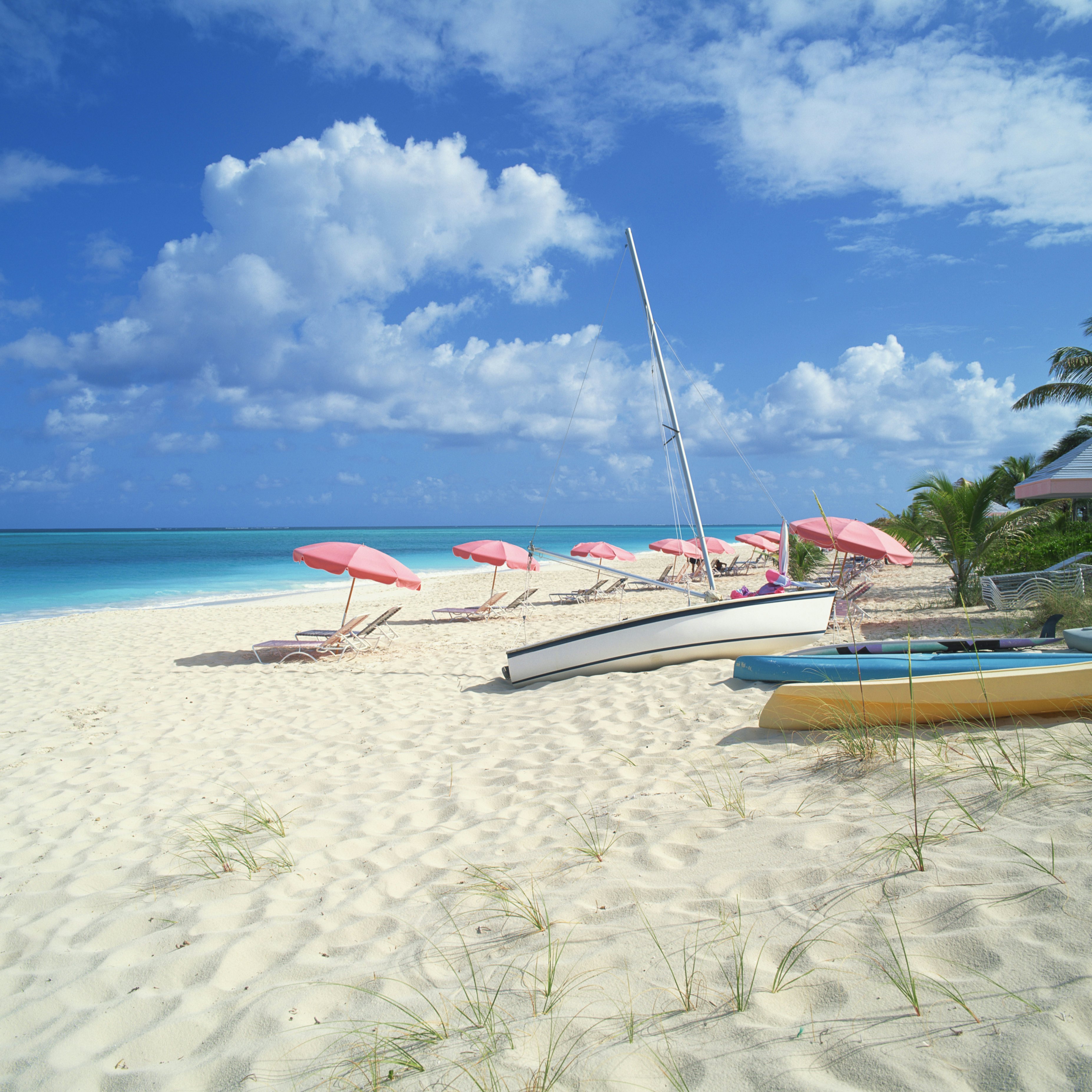 Beach with umbrellas and boats
