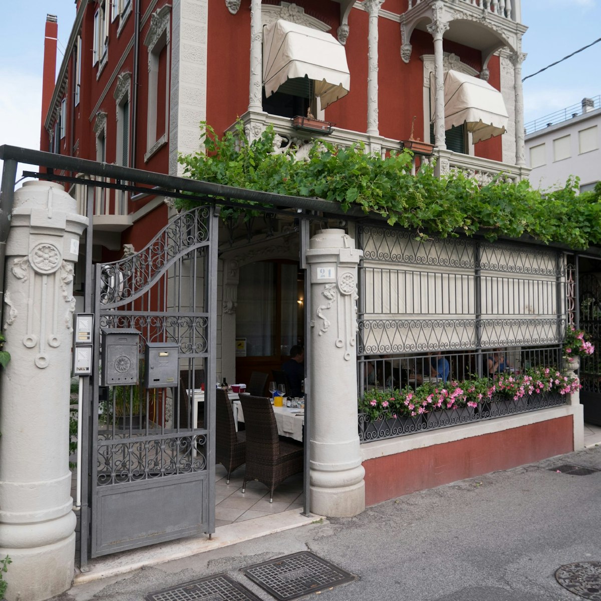 Trattoria Andri stands on a quiet street and has a leafy veranda containing outdoor seating