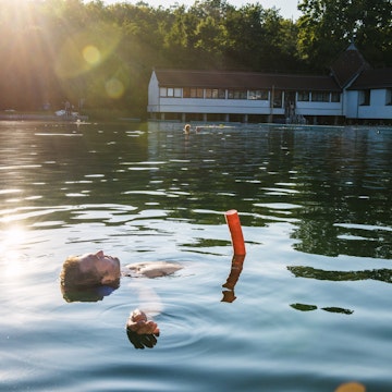 Man floating in thermal Lake Heviz.