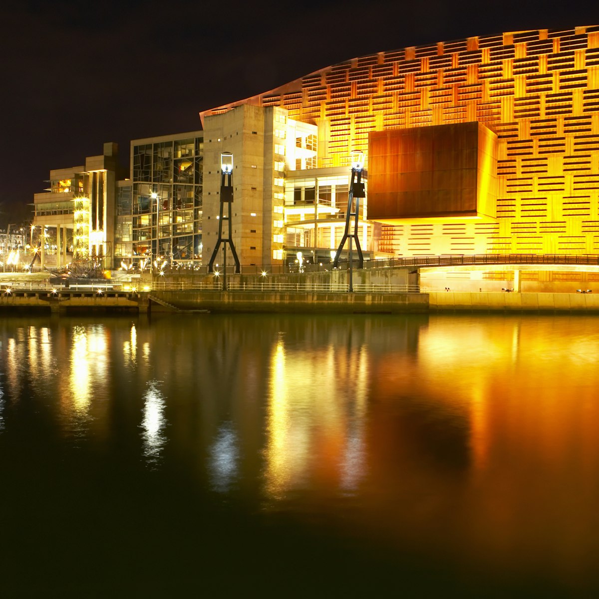 Spain, Bilbao, Museo Maritimo, Ria De Bilbao, illuminated at night