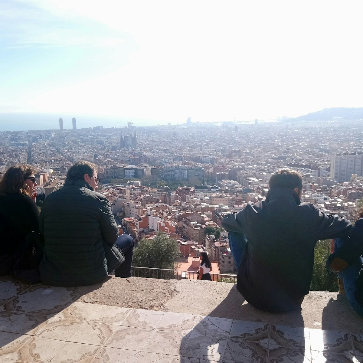 People admiring the view from Turó de la Rovira
