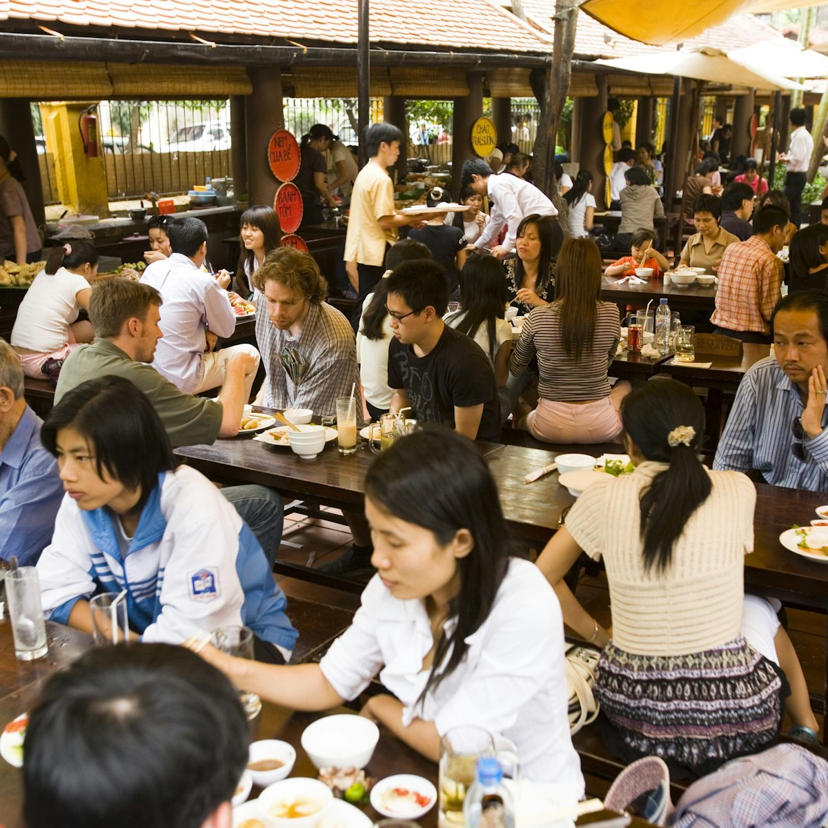 Diners at Quan An Ngan courtyard restaurant, French Quarter.