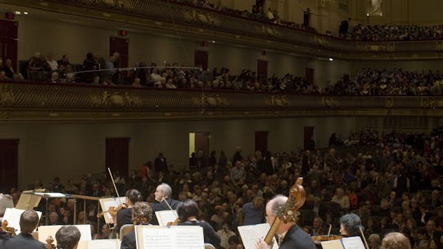 Boston Symphony Orchestra performing on stage.