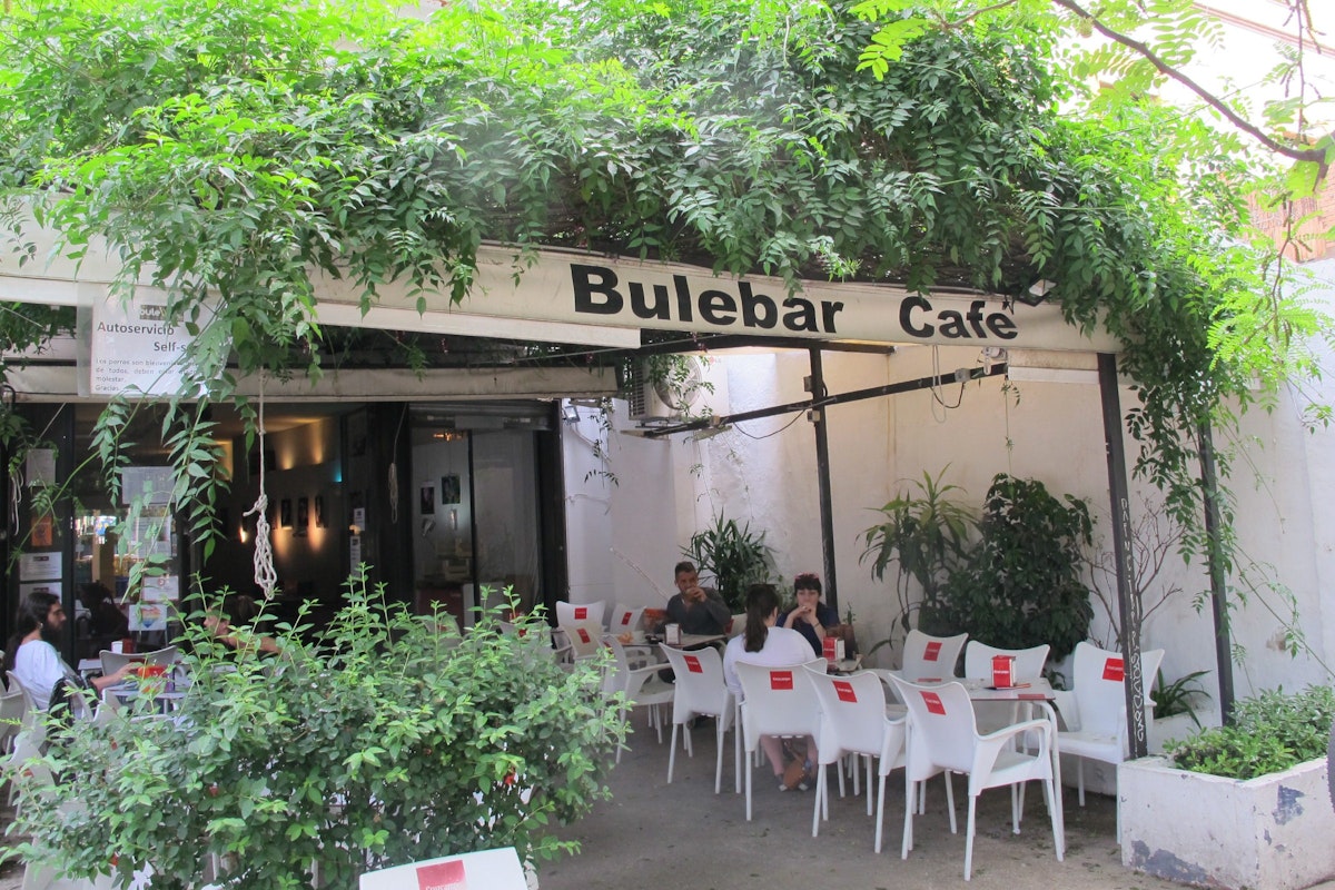 Plant-covered tent with tables and chairs, Bulebar Cafe.