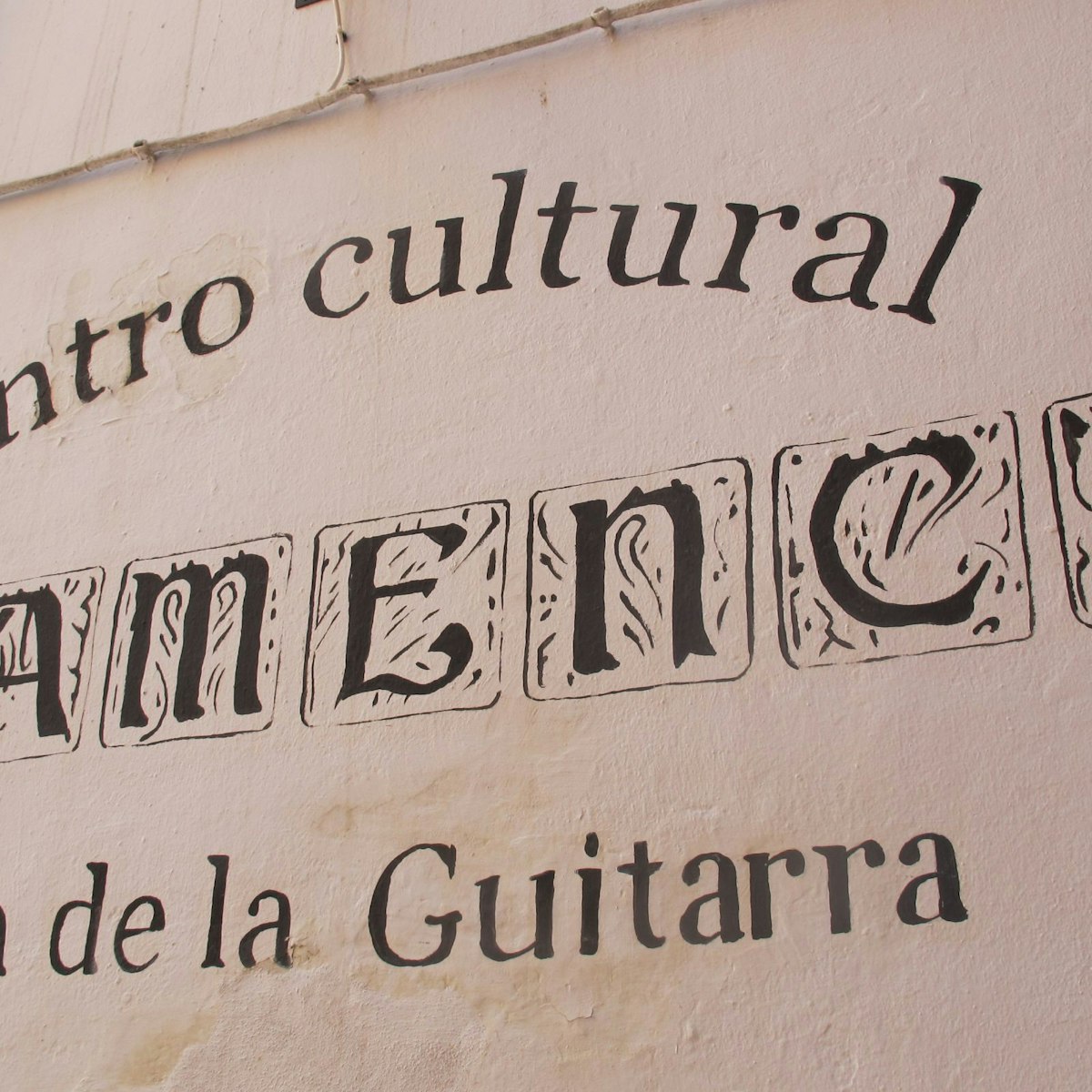 Casa de la Guitarra name on wall.
