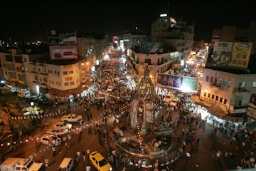 West Bank city of Ramallah, Palestinians in the streets at evening on the last day of the holy month of Ramadan