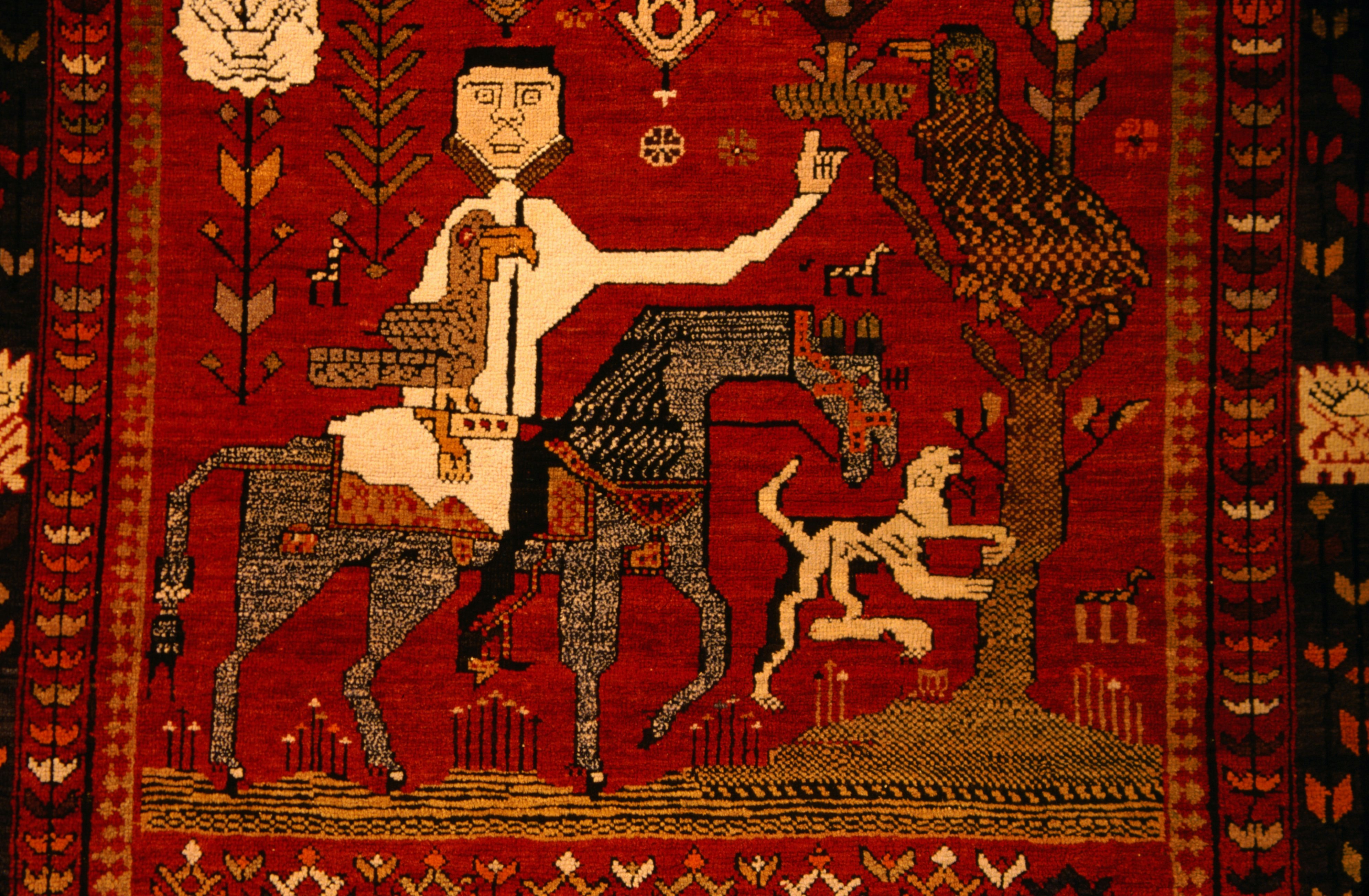 Detail of antique carpet on display at Textile Museum of Canada.