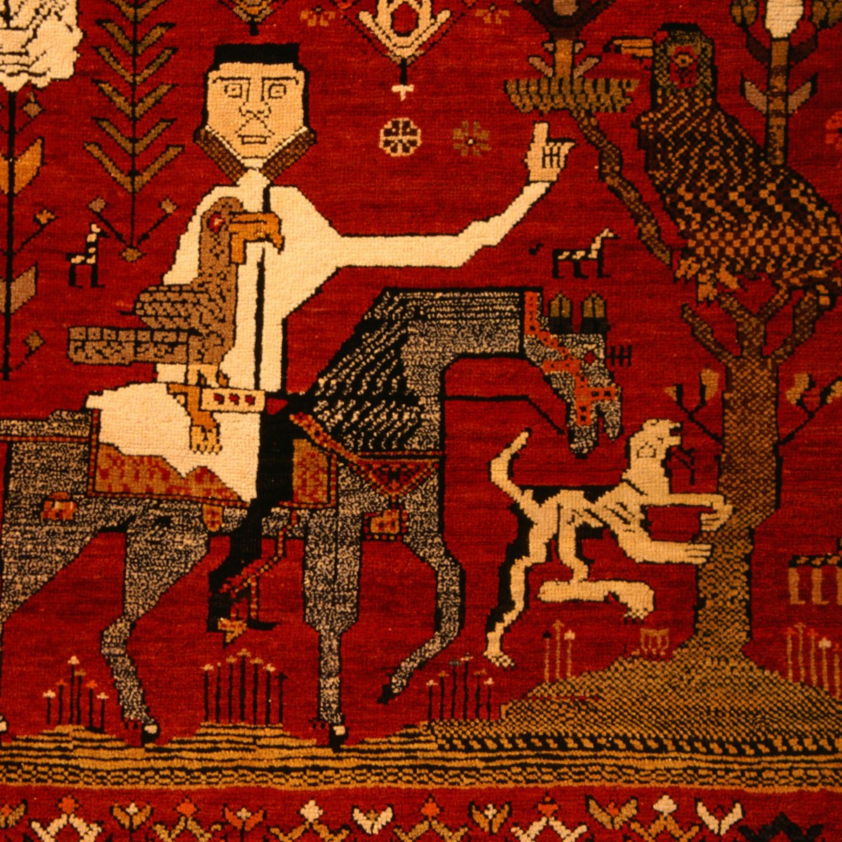 Detail of antique carpet on display at Textile Museum of Canada.