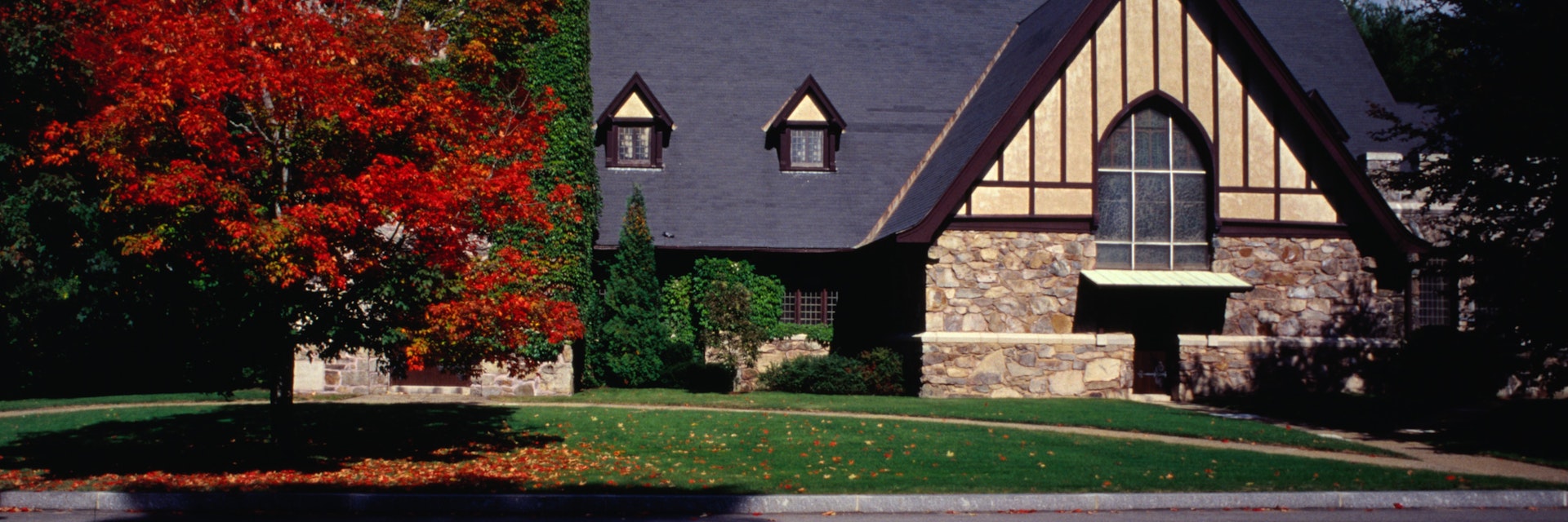 Tudor style architecture amongst autumn colours.