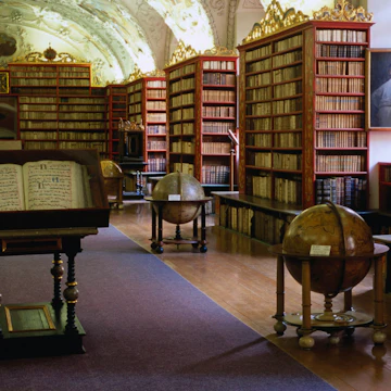 Globes and bookshelves in Theology Hall, Strahov Monastery.