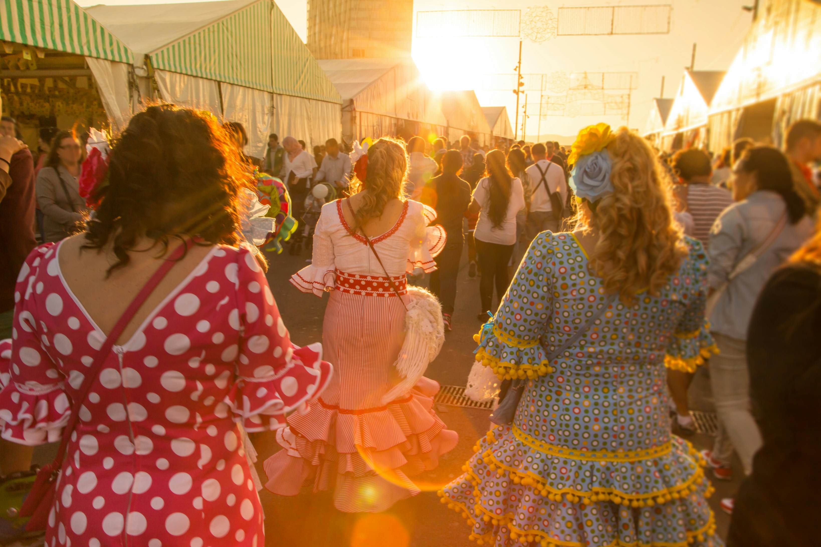 Women with flamenco dress in Feria de Abril.