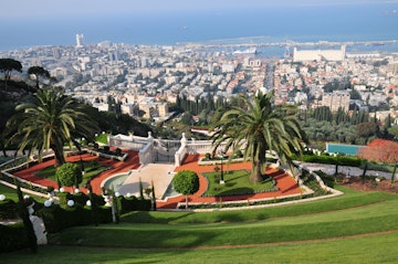 Israel, Haifa, The gardens of the Bahai Shrine downtown Haifa in the background