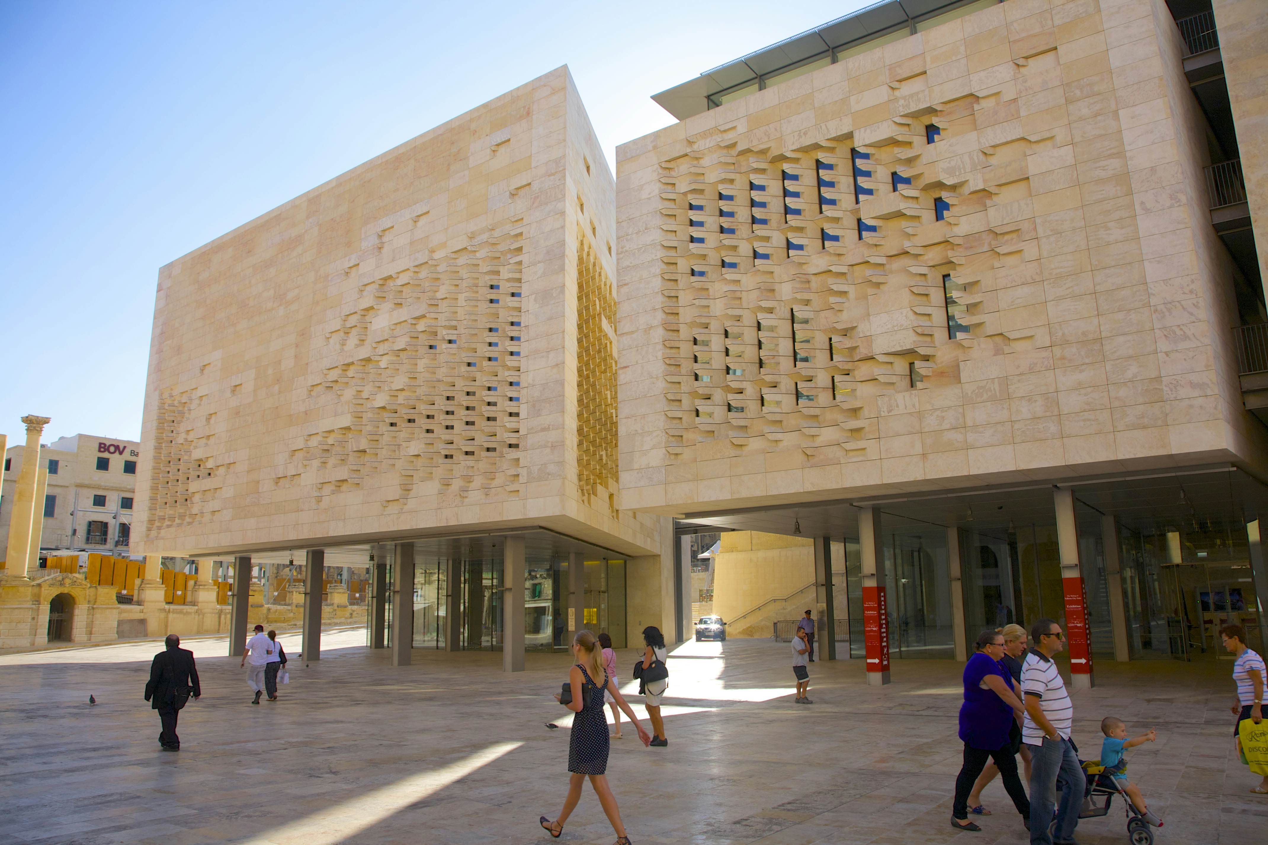 Modern stone and glass Parliament building near Valletta City Gate at entrance to Valletta, Malta.  Designed by architect Renzo Piano of Renzo Piano Building Workshop and completed in 2014.