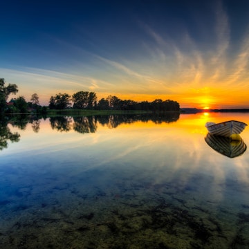 Beautiful landscape of the masurian lakes during a sunset in Poland.