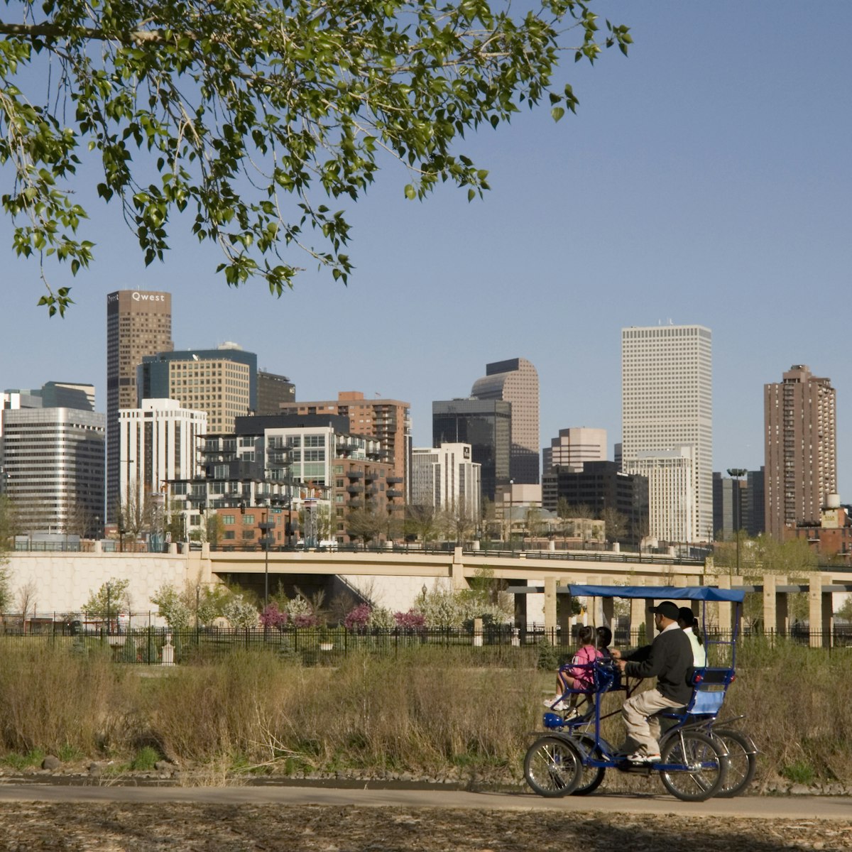 Hispanic family biking in Confluence Park near downtown Denver, Colorado, USA