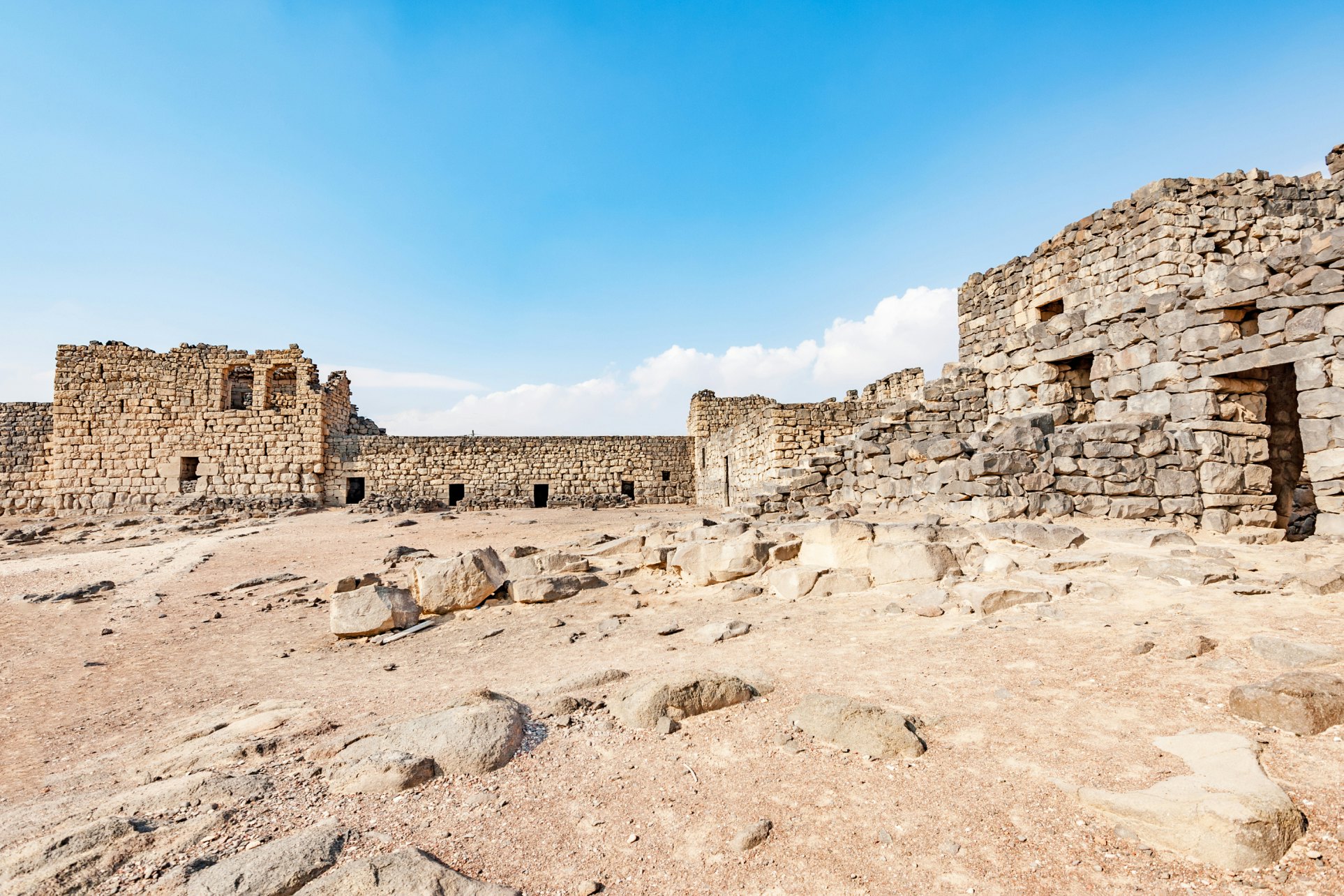 Qasr Azraq in present-day eastern Jordan. It is located about 100 km east of Amman. Qasr Azraq is one of the desert castles in Jordan and is known as Qasr Al Azraq.; Shutterstock ID 300918770; Your name (First / Last): Lauren Keith; GL account no.: 65050; Netsuite department name: Content Asset; Full Product or Project name including edition: Jordan 2017