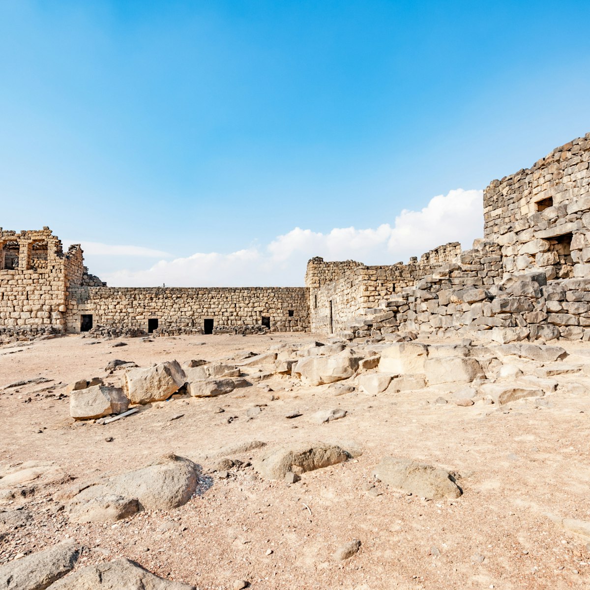 Qasr Azraq in present-day eastern Jordan. It is located about 100 km east of Amman. Qasr Azraq is one of the desert castles in Jordan and is known as Qasr Al Azraq.; Shutterstock ID 300918770; Your name (First / Last): Lauren Keith; GL account no.: 65050; Netsuite department name: Content Asset; Full Product or Project name including edition: Jordan 2017