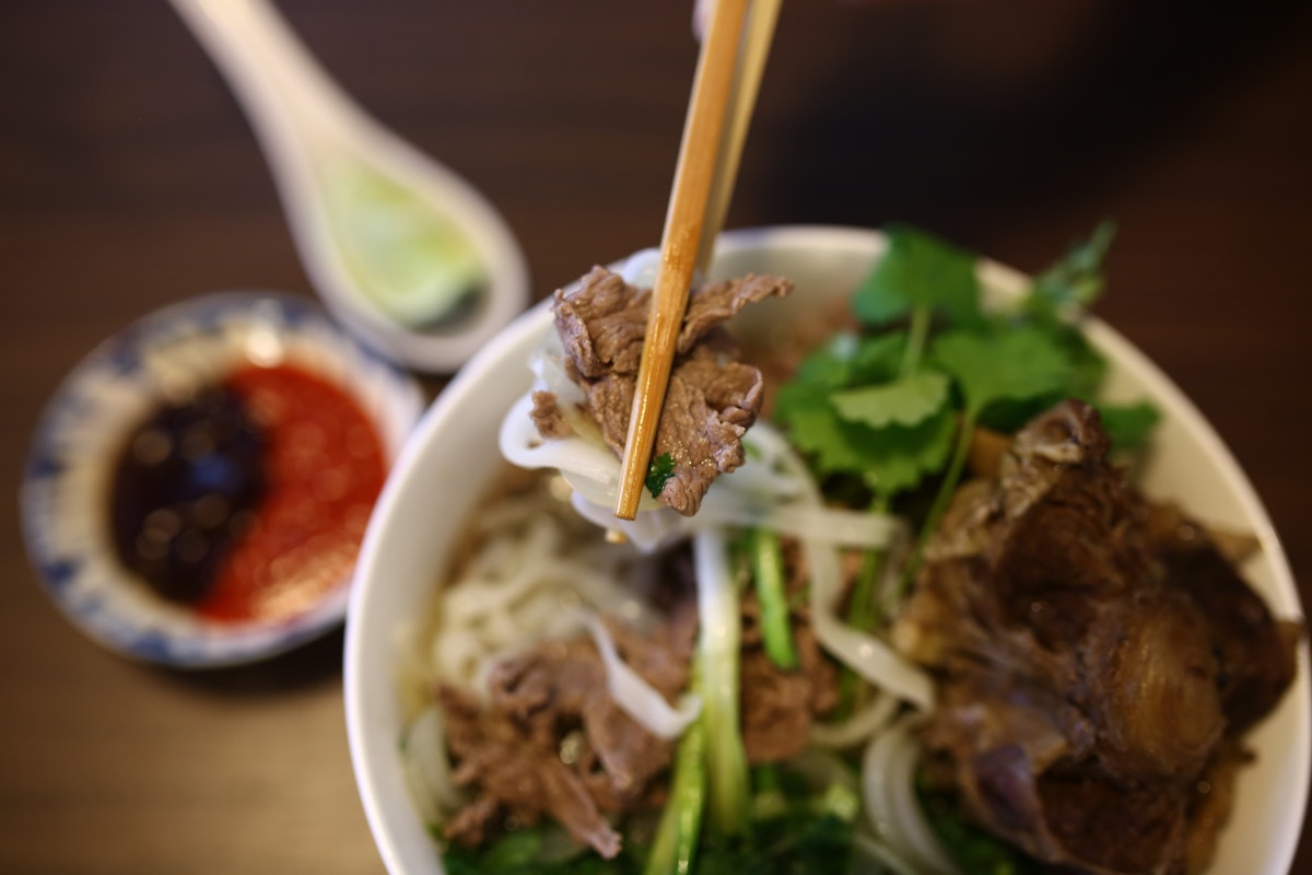 500px Photo ID: 83172141 - Vietnamese rice noodles are served with beef, lime, hoisin sauce and chili sauce and ready to eat..Lens: Sigma 35mm f/1.4 DG HSM Art Lens for Canon