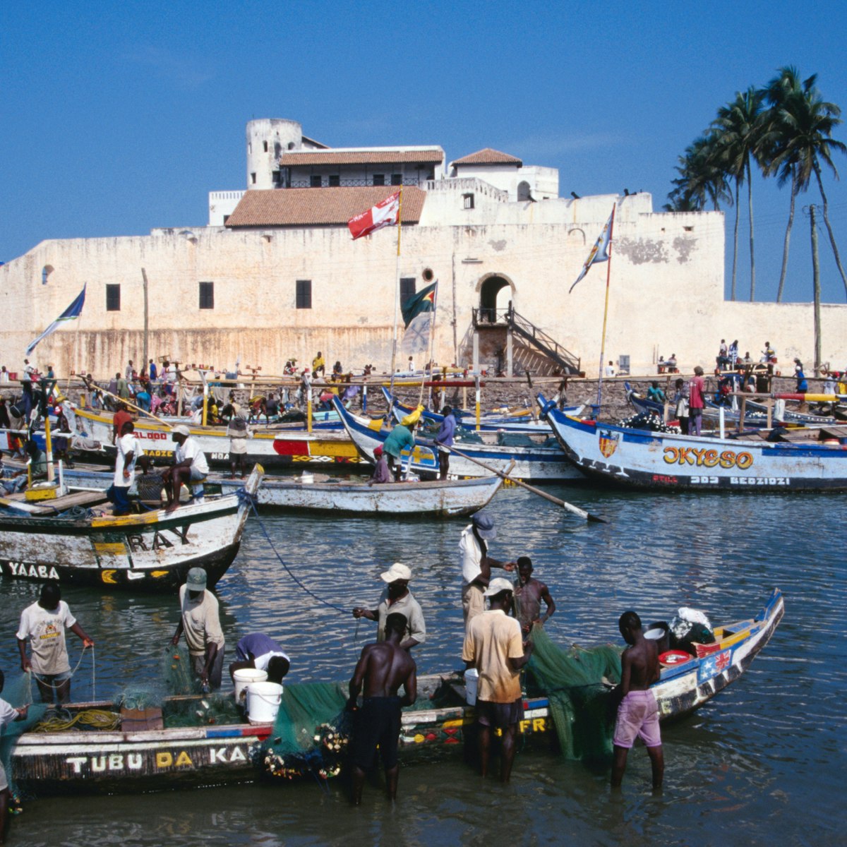 Fishermen and their colourful boats in front of St George's Castle.