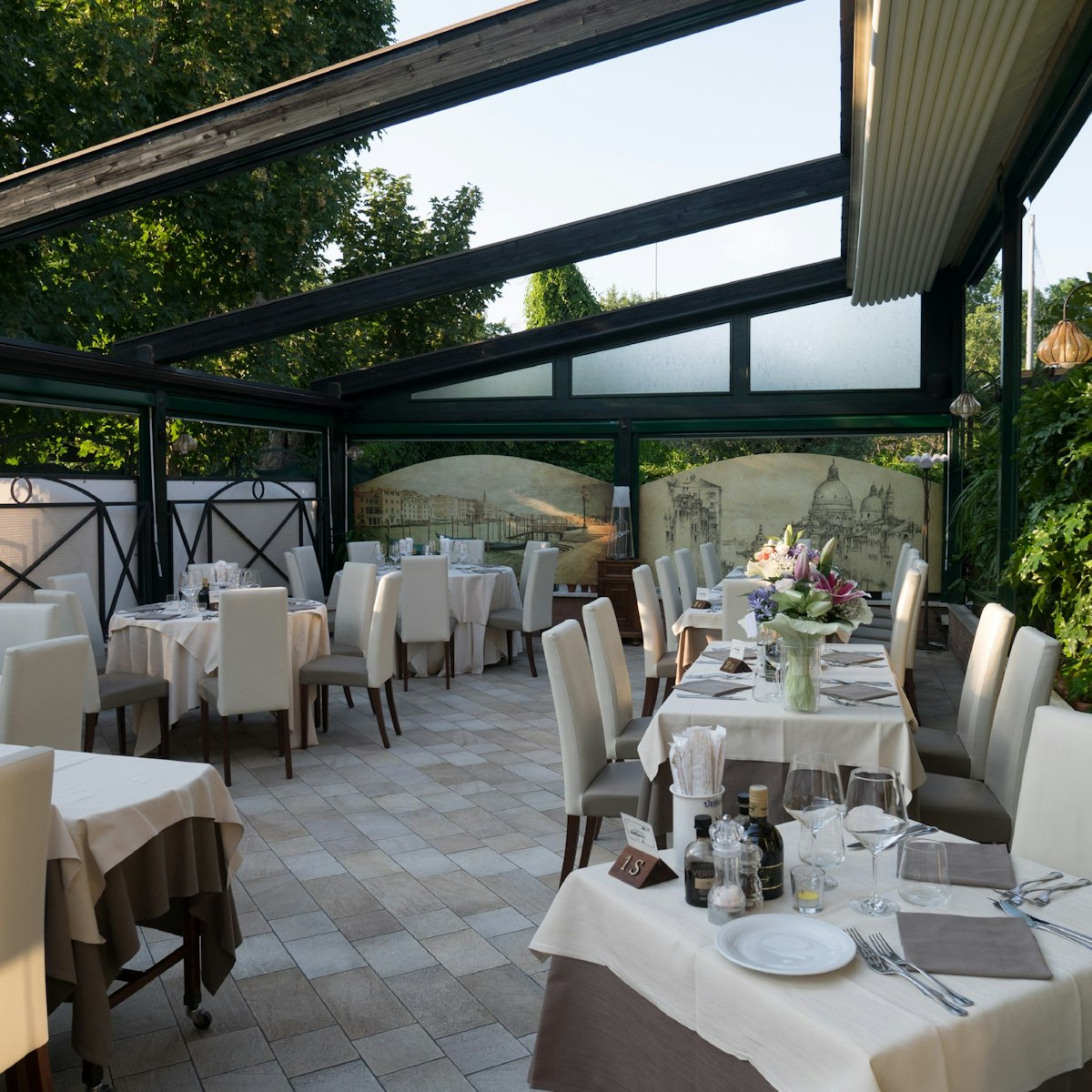 In summer months, alfresco dining takes place in the pretty garden at La Favorita