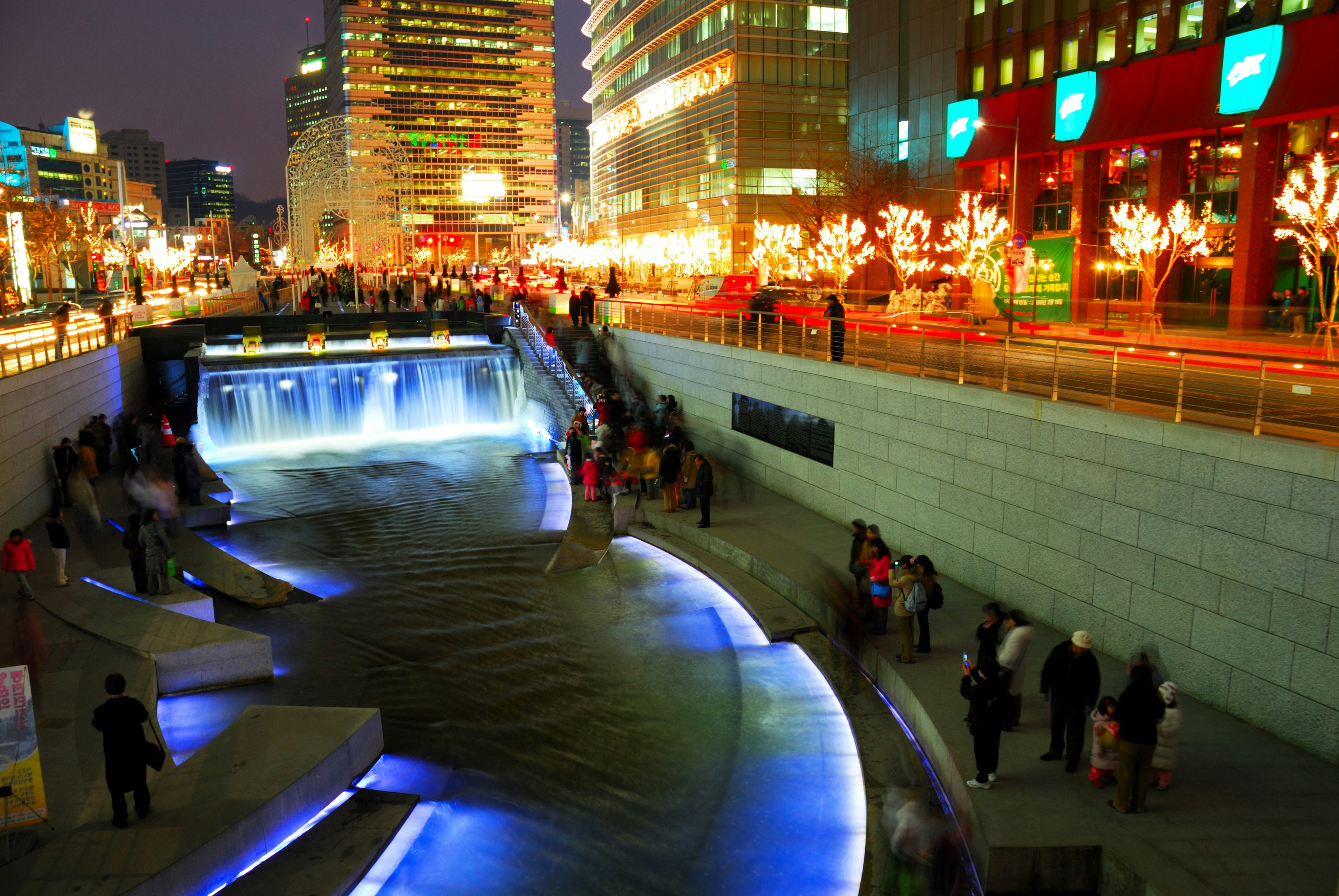 The Cheonggyecheon Stream draws crowds of locals out in early evening.