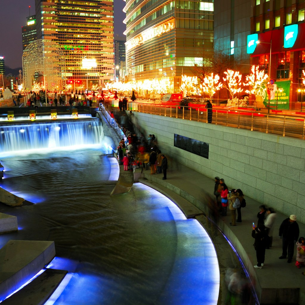 The Cheonggyecheon Stream draws crowds of locals out in early evening.