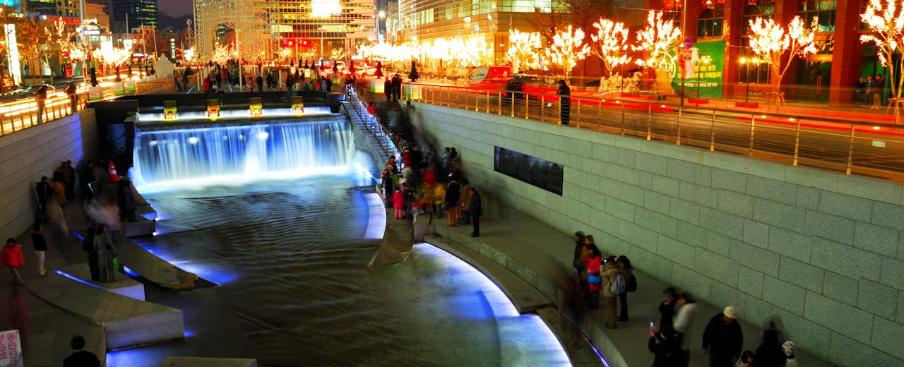 The Cheonggyecheon Stream draws crowds of locals out in early evening.