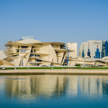 DOHA, QATAR - FEBRUARY 10 - 2018: New Qatar National Museum Construction Site. in Cornish in Doha, Qatar, Middle-East.; Shutterstock ID 1047832888; Your name (First / Last): Lauren Keith; GL account no.: 65050; Netsuite department name: Online Editorial; Full Product or Project name including edition: Destination page image update