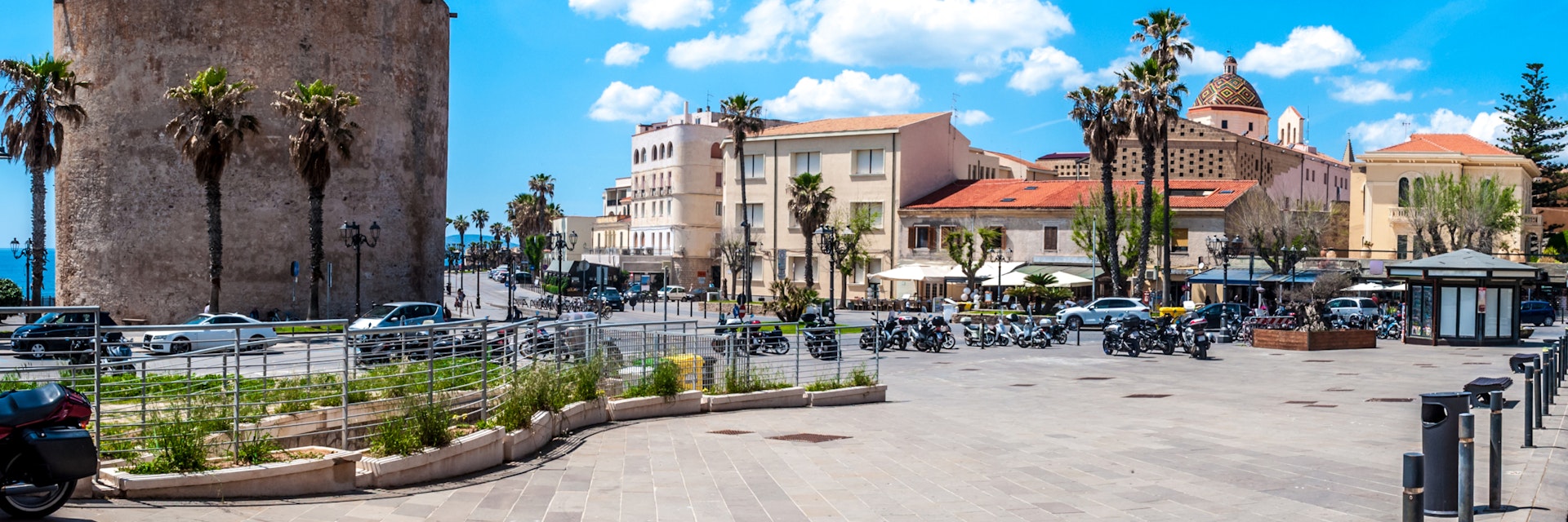 pedestrian area on the ramparts near the Sulis Tower in Alghero - Sardinia in a sunny day of spring; Shutterstock ID 1098623615; Your name (First / Last): Anna Tyler; GL account no.: 65050; Netsuite department name: Online Editorial; Full Product or Project name including edition: destination-image-southern-europe