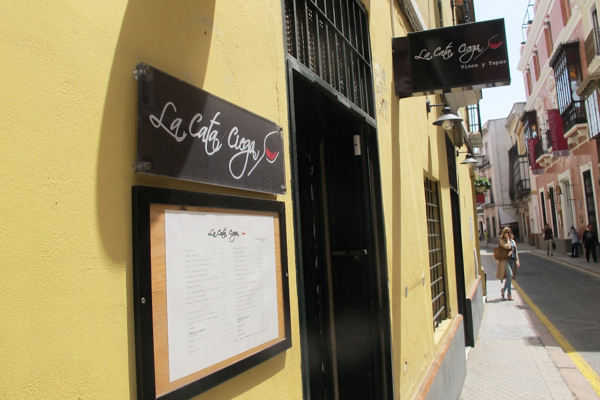 Restaurant sign on wall , La Cata Ciega.