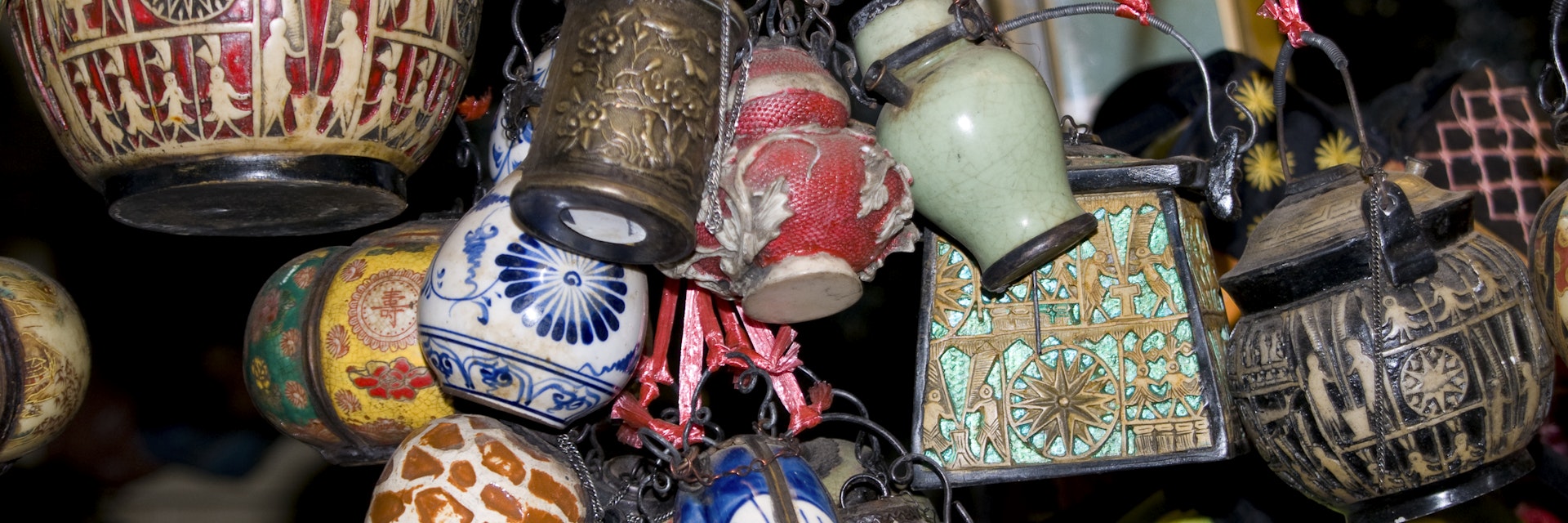 Bells and other treasures hanging in the Russian Market in Phnom Penh, Cambodia