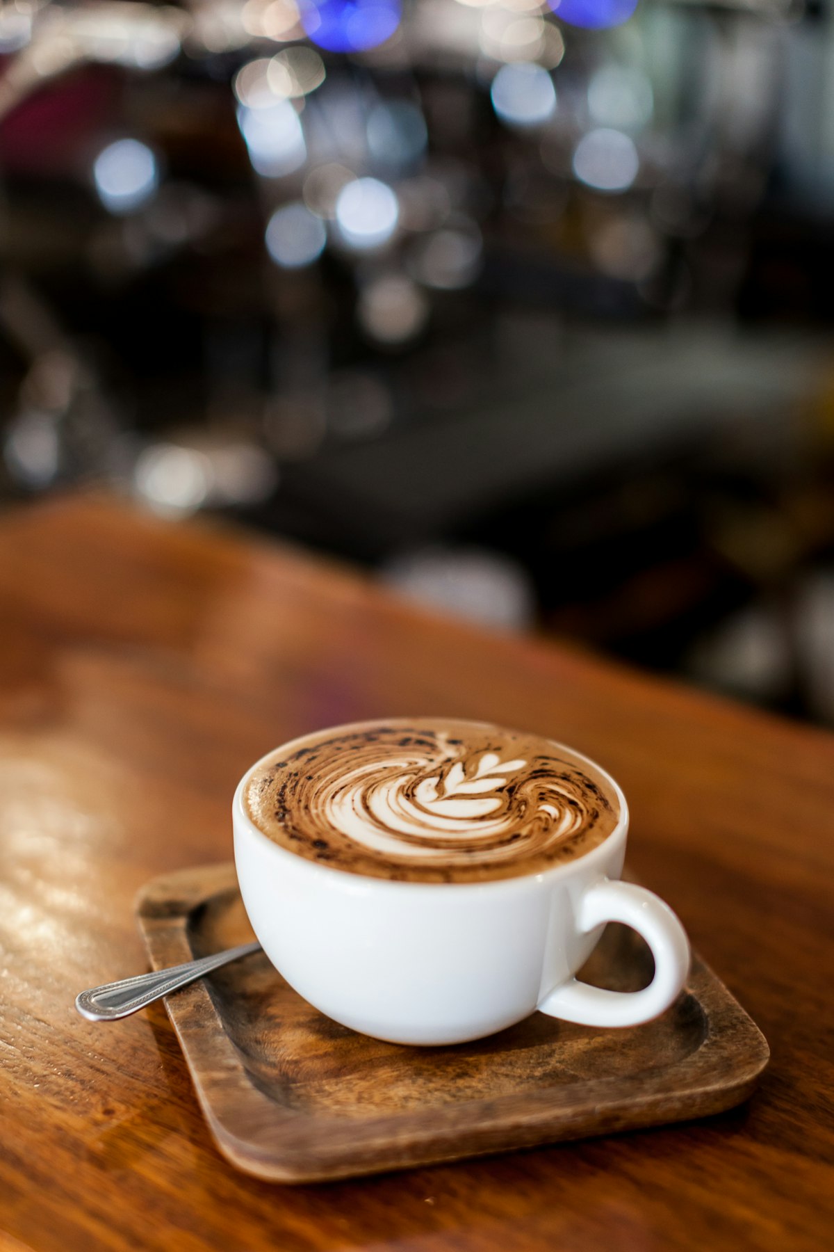 Cup of coffee latte on wood bar. ; Shutterstock ID 767149903