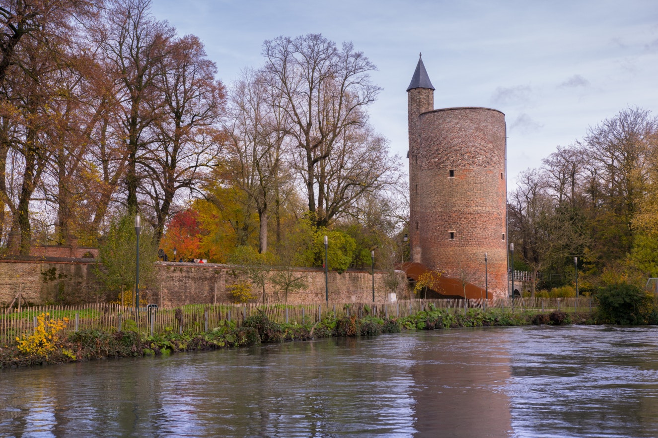 Tower in Minnewater park in Bruges, Belgium; Shutterstock ID 525022591; Your name (First / Last): Daniel Fahey; GL account no.: 65050; Netsuite department name: Online Editorial; Full Product or Project name including edition: POI image