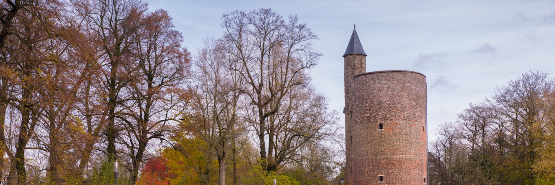 Tower in Minnewater park in Bruges, Belgium; Shutterstock ID 525022591; Your name (First / Last): Daniel Fahey; GL account no.: 65050; Netsuite department name: Online Editorial; Full Product or Project name including edition: POI image