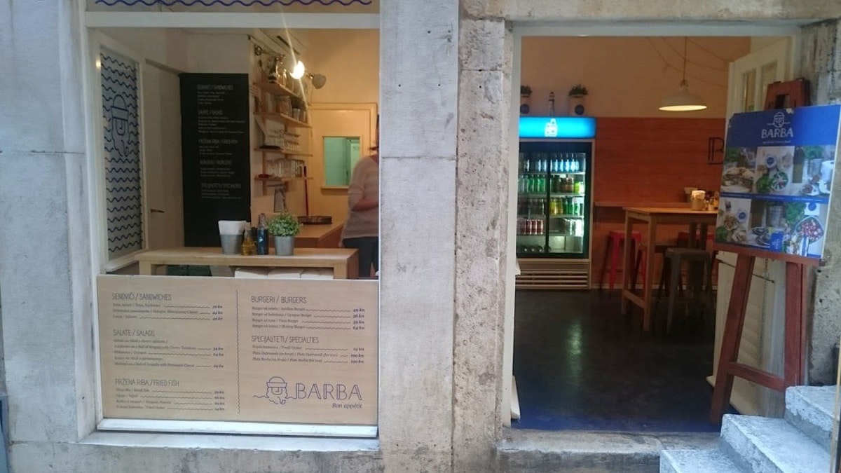 Barba entrance and the front window table