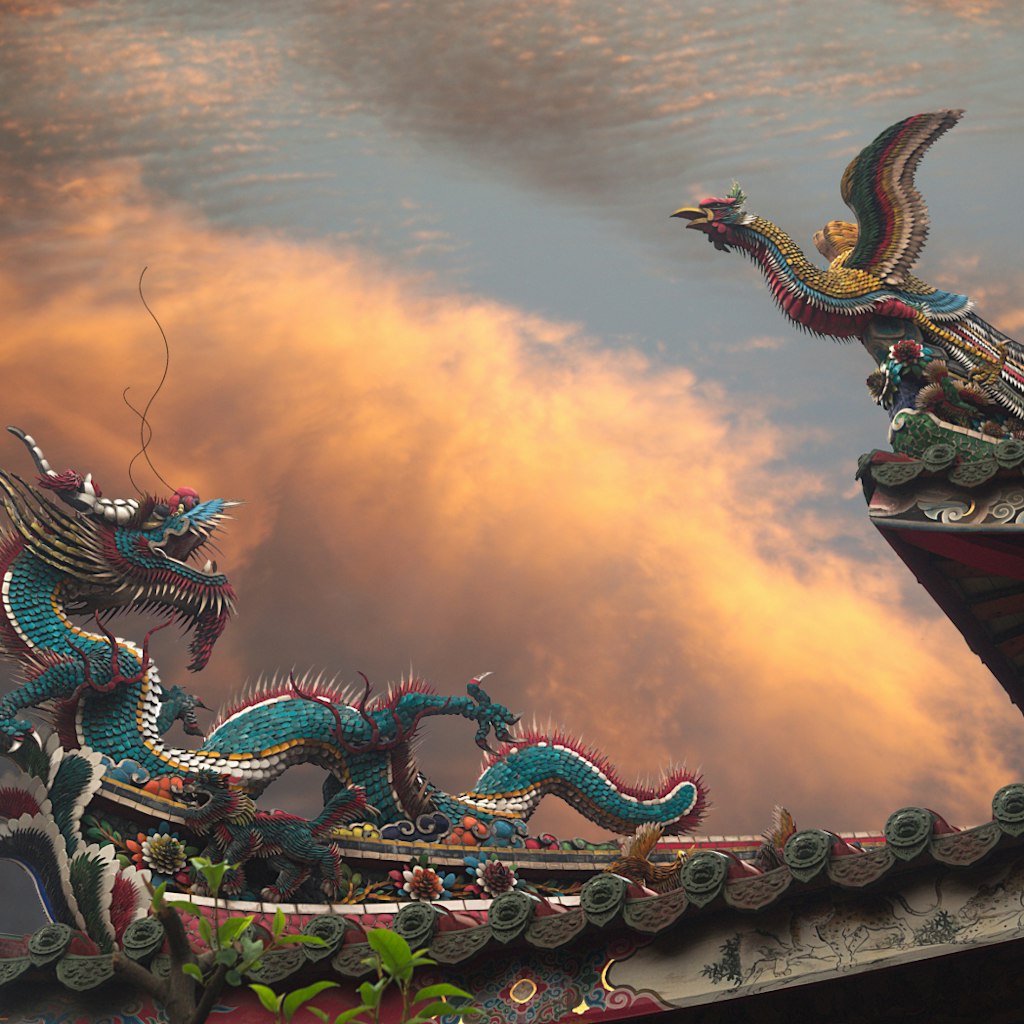 500px Photo ID: 132008549 - A Dragon and a Phoenix (Fenghuang  fènghuáng / 凤凰 / 鳳凰 or August Rooster kūnjī / 鹍鸡 / 鶤雞) on the roof of Mengjia Longshan Temple (艋舺龍山寺 nee Lungshan Temple) in Wanhua District, Taipei, Taiwan. Golden Hour, dramatic clouds in background. Temple is of Chinese folk religion.
